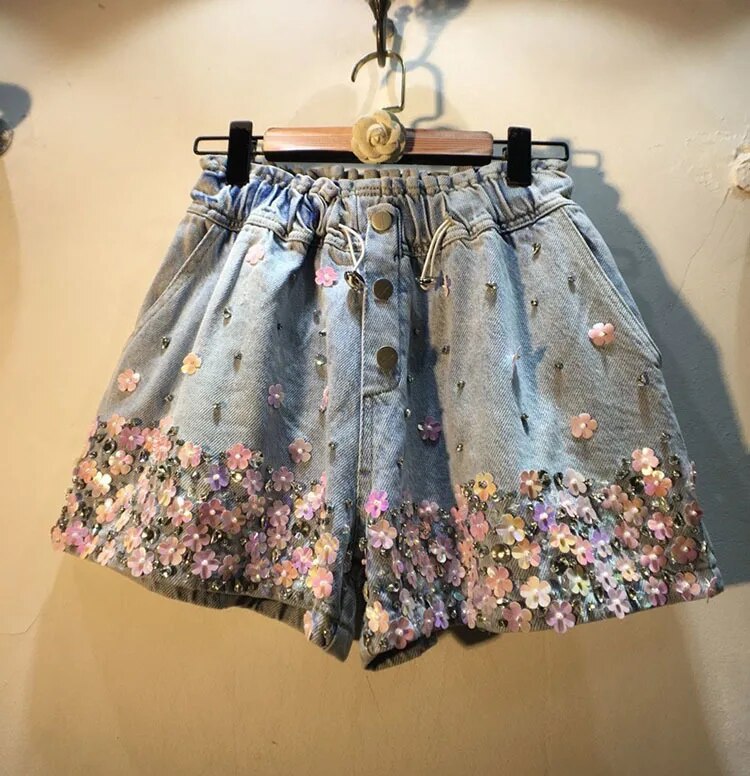 SHORT JEANS FLORAL FEMININO CÓS ALTO - VERÃO 2024